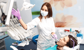 A dentist performing an oral exam