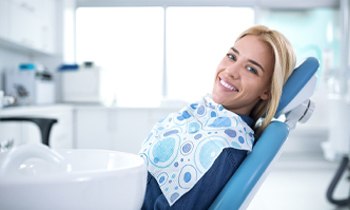 A young woman sitting in a dentist chair