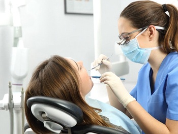 dentist treating young female patient
