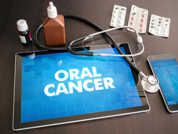 tablet with the words “oral cancer” on it