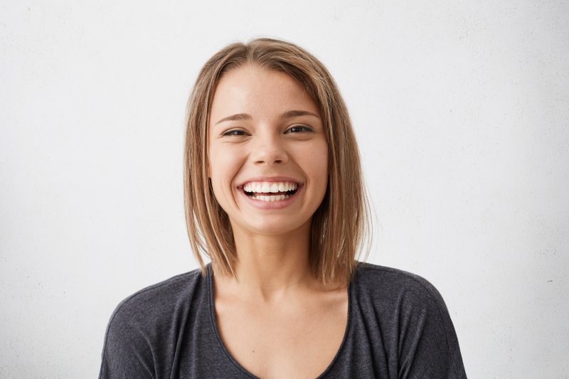 person with dental implants smiling